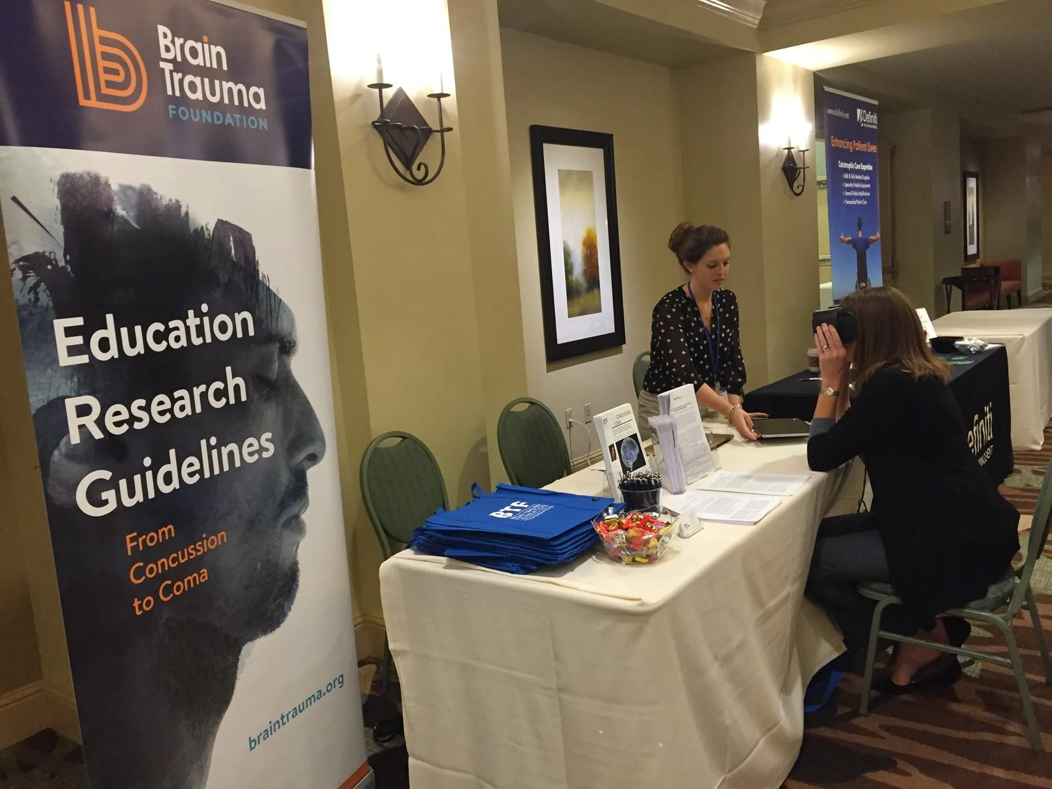 The foundation’s conference booth, the banner standing beside a table of materials